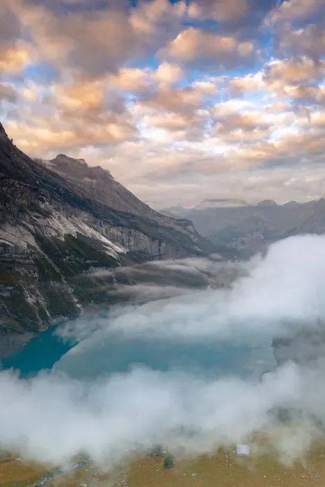 Framed Print : Clouds at sunset over the pristine lake Oeschinensee in the mist, Bernese Oberland Framed Print : Clouds at sunset over the pristine lake Oeschinensee in the mist, Bernese Oberland