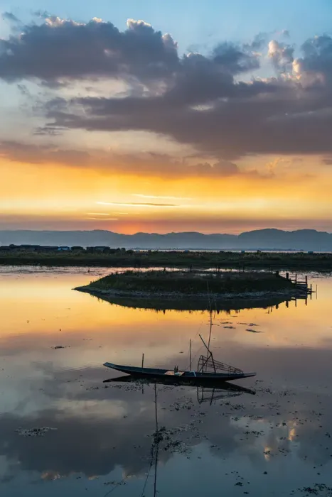 Framed Print : Clouds and traditional rowing boat reflecting in the water at sunset, Inle Lake Framed Print : Clouds and traditional rowing boat reflecting in the water at sunset, Inle Lake