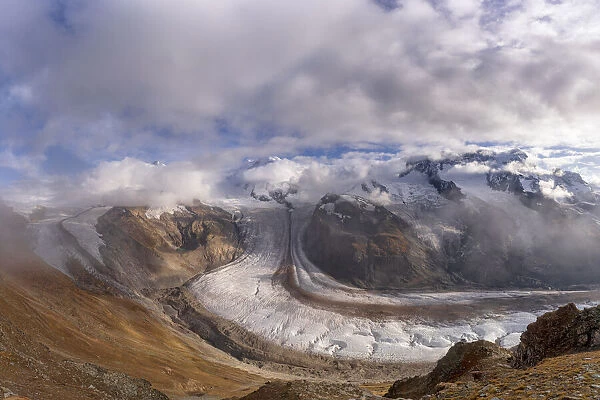 Cloudy sky over snowcapped mountains and Gorner Glacier (Gornergletscher), Zermatt