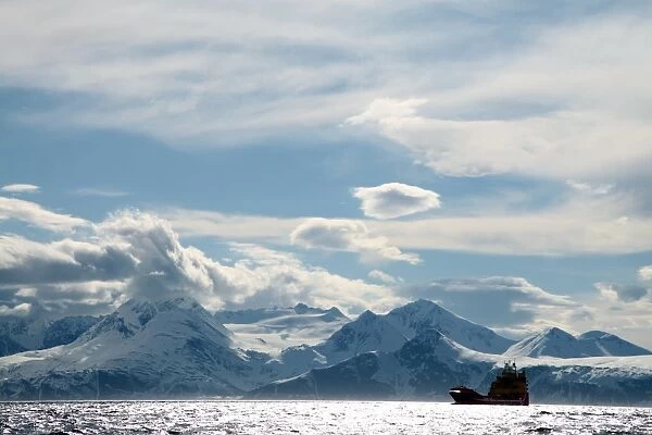 Coastal freighter and the Lyngen Alps, Troms, arctic Norway, Scandinavia, Europe