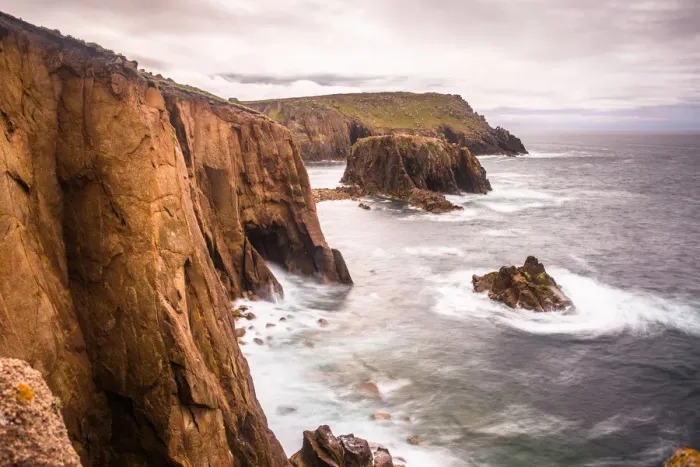 Framed Print : Coastal scenery with Enys Dodnan rock formation at Lands End, Cornwall, England, United Framed Print : Coastal scenery with Enys Dodnan rock formation at Lands End, Cornwall, England, United
