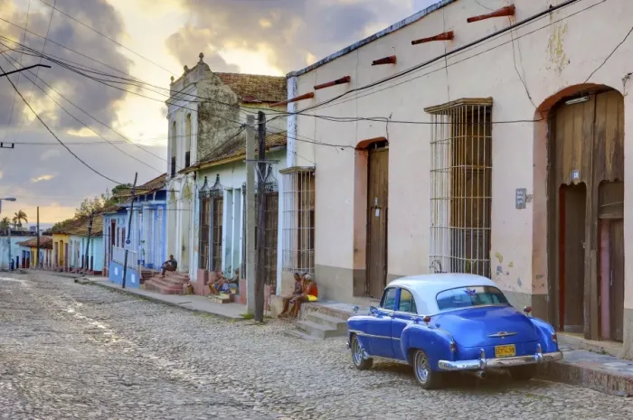 Framed Print : Cobbled street at sunset with classic American car, Trinidad, Cuba, West Indies