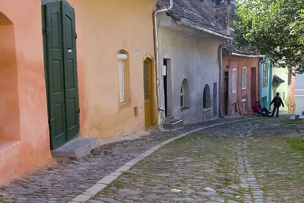 Cobbled streets lined with colourfully painted 16th century burgher houses in the medieval citadel