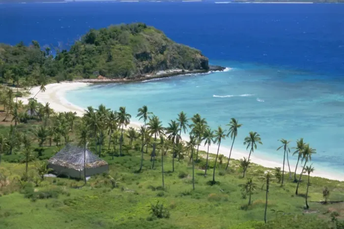 Framed Print : Coconut plantation and old farmhouse beside coral sand bay, Mana Island
