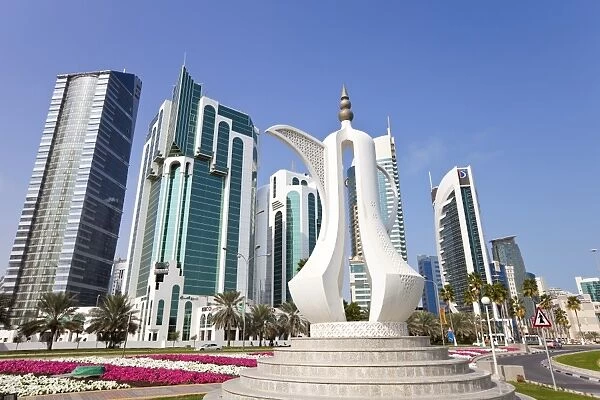 Coffee pot monument and the new skyline of the West Bay central financial district of Doha, Qatar, Middle East