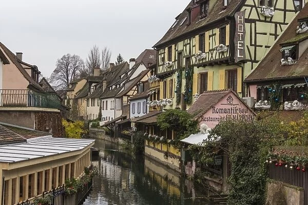 Colored houses reflected in river Lauch at Christmas time, Petite Venise, Colmar