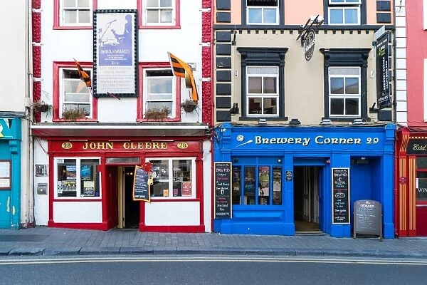 Colorful building fronts of traditional beer pubs in Kilkenny, County Kilkenny, Leinster