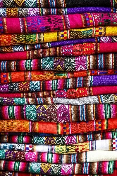 Colorful carpets made of llama and alpaca wool for sale at San Pedro market, Cuzco, Peru