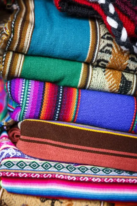 Framed Print : Colorful carpets made of llama and alpaca wool for sale at San Pedro market, Cuzco, Peru