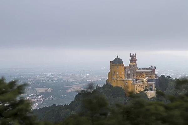The colorful castle of Palacio da Pena, UNESCO World Heritage Site, on top of hill
