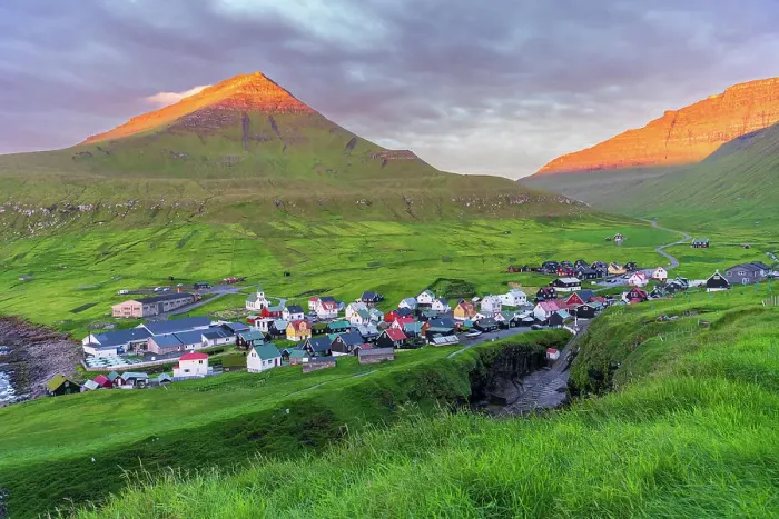 Framed Print : Colorful houses of the village of Gjogv with the mounatins lit by the early sun, sunrise view, Eysturoy island, Faroe islands, Denmark, Europe Framed Print : Colorful houses of the village of Gjogv with the mounatins lit by the early sun, sunrise view, Eysturoy island, Faroe islands, Denmark, Europe