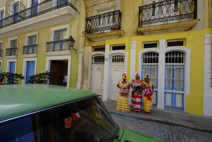 Framed Print : Three colorful ladies in traditional dress, Old Havana, Cuba, West Indies Framed Print : Three colorful ladies in traditional dress, Old Havana, Cuba, West Indies
