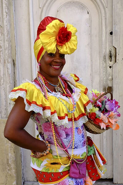 Colorful lady in traditional dress, Old Havana, Cuba, West Indies, Central America