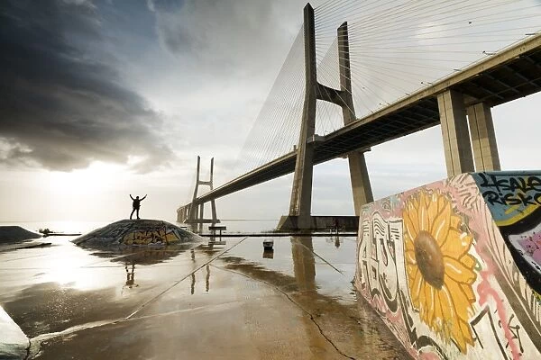 The colorful murals around Vasco Da Gama bridge emphasize its architecture and atmosphere at dawn