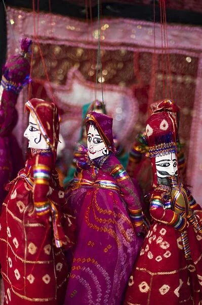 Colorful puppets hanging in a shop in Udaipur, Rajasthan, India, Asia