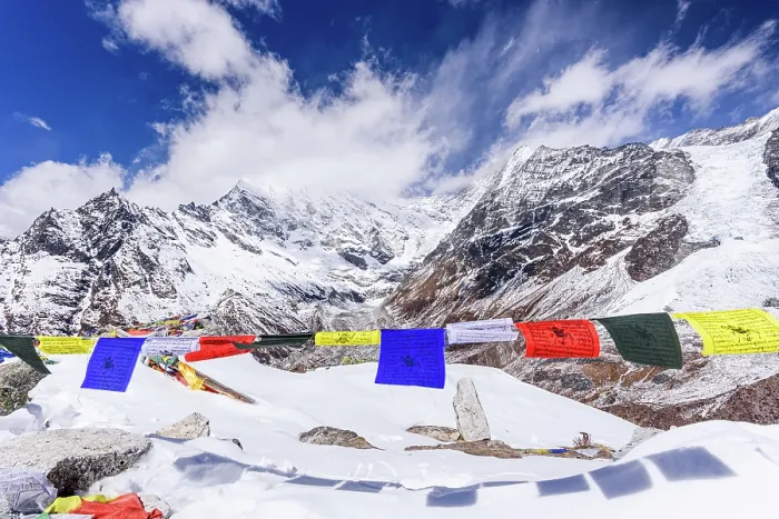 Framed Print : Colorful Tibetan Prayer Flags Fluttering on the Snowy Summit of Kyanjin Ri with Langtang Lirung Towering in the Background on a Clear Winter Day Framed Print : Colorful Tibetan Prayer Flags Fluttering on the Snowy Summit of Kyanjin Ri with Langtang Lirung Towering in the Background on a Clear Winter Day
