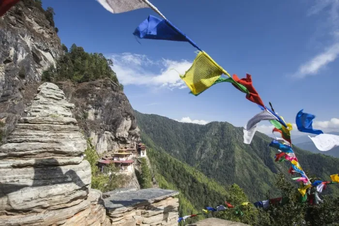 Framed Print : The colorful Tibetan prayer flags invite the faithful to visit the Taktsang Monastery Framed Print : The colorful Tibetan prayer flags invite the faithful to visit the Taktsang Monastery