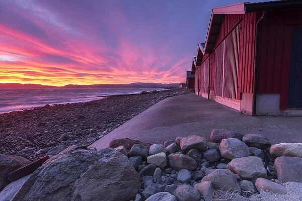 The colors of dawn light up the houses of fishermen, Arland Brekstad, Trondelag, Norway