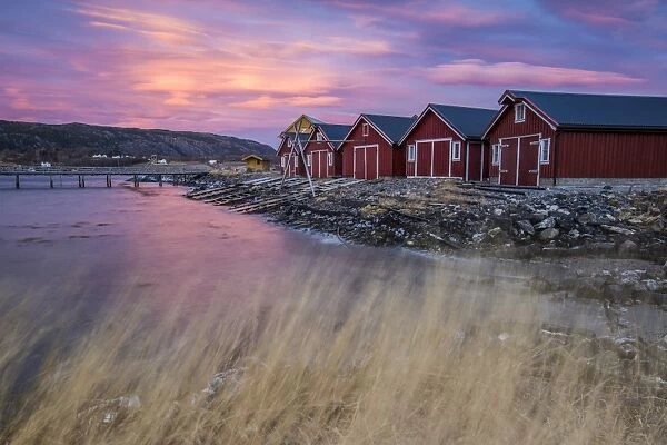 The colors of dawn light up the houses of fishermen, Flatanger, Trondelag, Norway