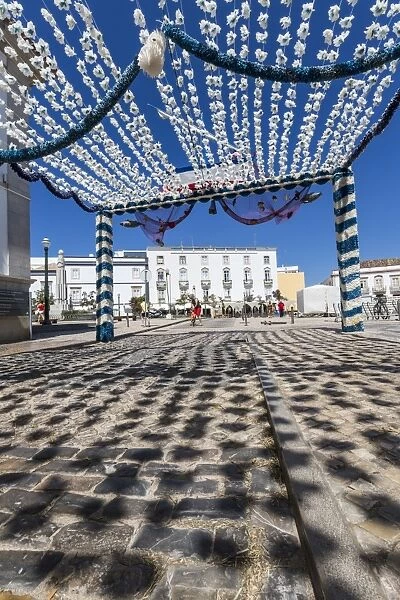 Colors and decoration in the pedestrian centre of Tavira on a sunny summer day, Faro