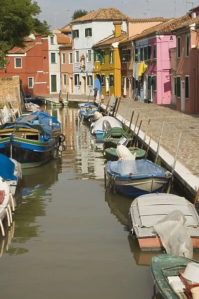 Coloured houses alongside canal