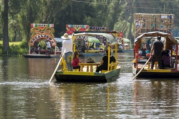 Colourful boats at the Floating Gardens in Xochimilco, UNESCO World Heritage Site, Mexico City, Mexico, North America