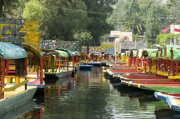Colourful boats at the Floating Gardens in Xochimilco, UNESCO World Heritage Site, Mexico City, Mexico, North America