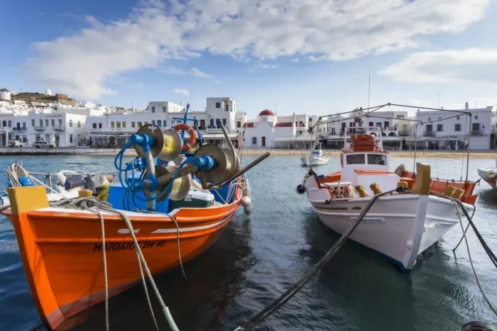 Framed Print : Colourful boats in harbour, whitewashed Mykonos Town (Chora) with windmills and churches Framed Print : Colourful boats in harbour, whitewashed Mykonos Town (Chora) with windmills and churches