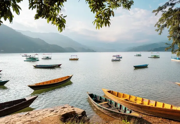 Framed Print : Colourful boats in front of Himalayan peaks on Lake Pokhara in Pokhara, Nepal, Asia Framed Print : Colourful boats in front of Himalayan peaks on Lake Pokhara in Pokhara, Nepal, Asia