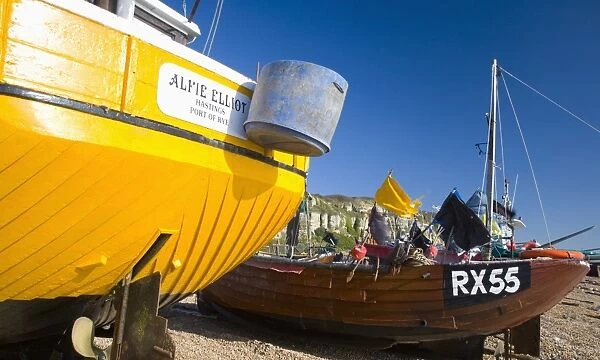 Colourful boats on pebble beach known as the Stade, home to Europes largest beach-based fishing fleet, Hastings, East Sussex, England, United