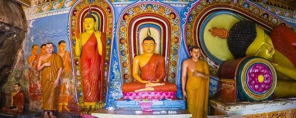 Colourful Buddha statues at Isurumuniya Vihara, Anuradhapura, UNESCO World Heritage Site, Sri Lanka, Asia