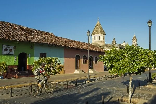 Colourful buildings and Church of Guadelupe on popular Calle de la Calazada in centre of this historic city, Granada, Nicaragua, Central America