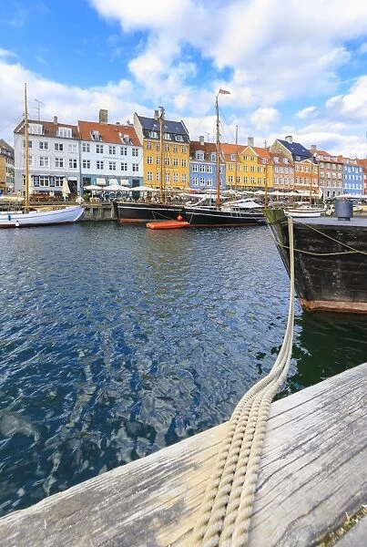 Colourful facades and typical boats along the canal and entertainment district of Nyhavn
