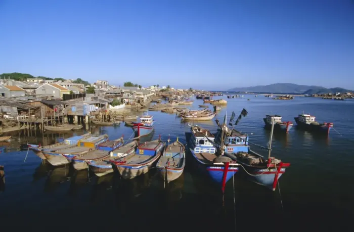 Framed Print : Colourful fishing boats in mouth of the Cai River Framed Print : Colourful fishing boats in mouth of the Cai River
