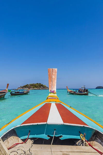 A colourful long tail boat on Ko Lipe Island in Tarutao National Marine Park, Thailand