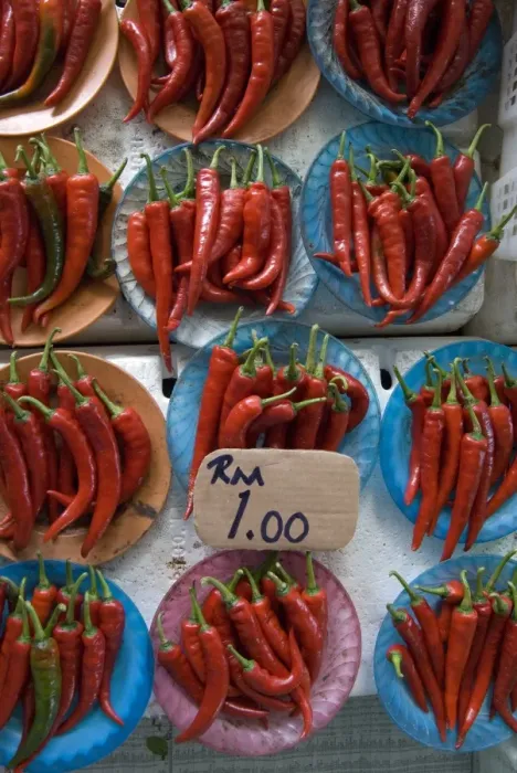 Framed Print : Colourful red chillies on blue plates on a market stall in Kuching, Sarawak