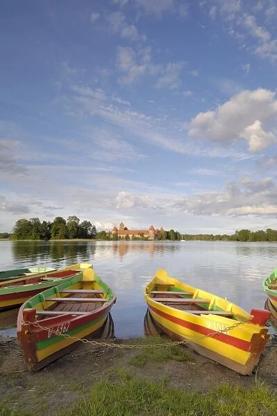 Colourful rowing boats and Trakai Castle