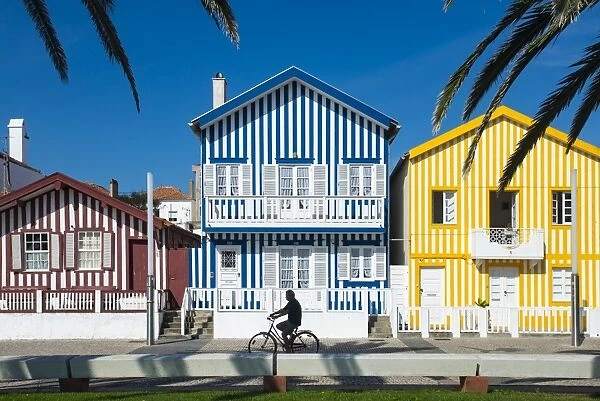 Colourful stripes decorate traditional beach house style on houses in Costa Nova