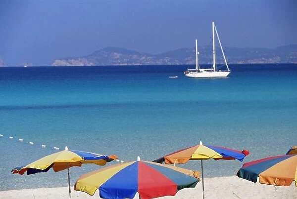 Colourful umbrellas on Playa de ses Illetes beach