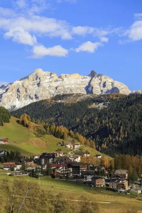 Framed Print : Colourful woods frame the village and the high peaks in autumn, Gardena Valley, South Tyrol Framed Print : Colourful woods frame the village and the high peaks in autumn, Gardena Valley, South Tyrol