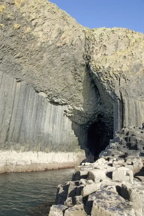 Framed Print : Columnar basalt lava with Fingals Cave cut into it by sea, Staffa Framed Print : Columnar basalt lava with Fingals Cave cut into it by sea, Staffa