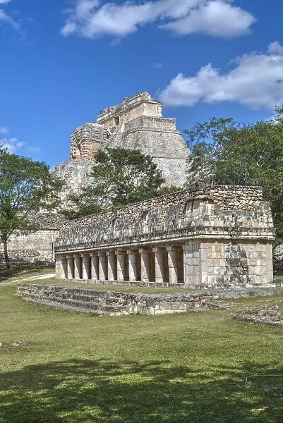 Columns Building in foreground with Pyramid of the Magician beyond, Uxmal, Mayan