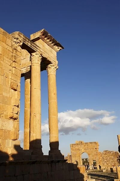 Columns of the Capitol and Arch of Antoninus Pius in the Forum at the Roman ruins of Sbeitla