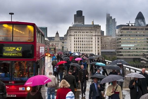 Commuters crossing London Bridge, London, England, United Kingdom, Europe
