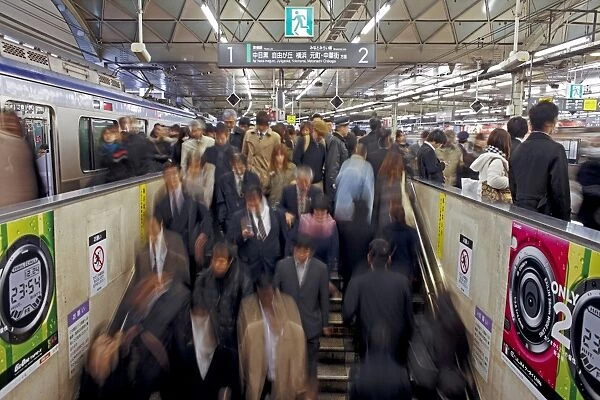 Commuters moving through Shibuya Station during rush hour, Shibuya District