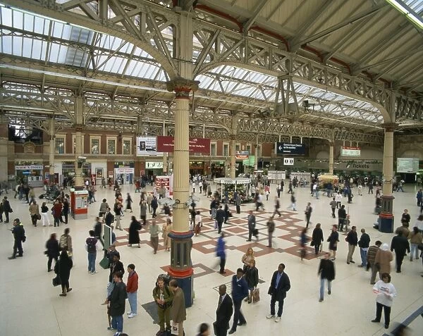 Commuters on the passenger concourse at Victoria Station in London, England