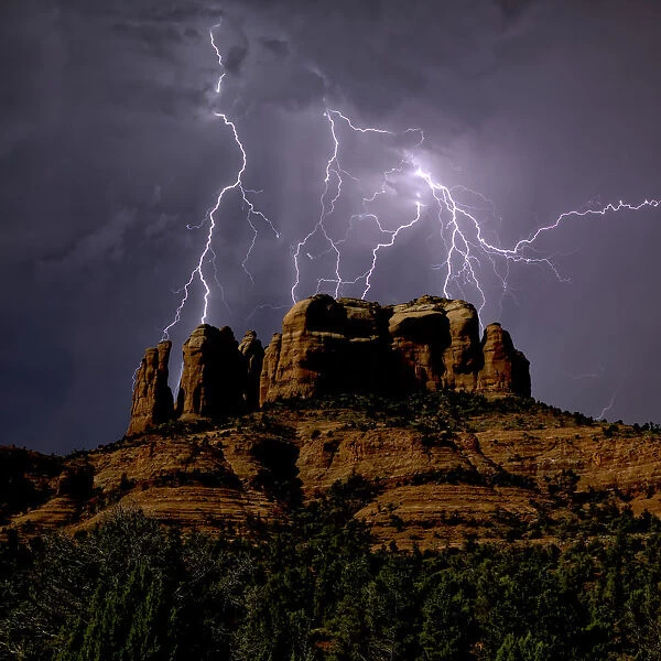 Composite photo of lightning striking southwest of Cathedral Rock in Sedona, Arizona