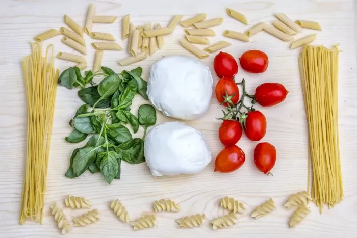Framed Print : Composition with the bright colours of Italian food: pasta, spaghetti, tomatoes from Sicily, mozzarella from Naples and basil, Italy, Europe Framed Print : Composition with the bright colours of Italian food: pasta, spaghetti, tomatoes from Sicily, mozzarella from Naples and basil, Italy, Europe