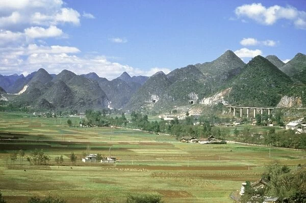 Conical limestone hills and Shanghai to Kunming Railway, Guilin, Shuicheng