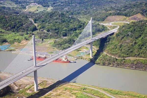 Container ship going under Centenario Bridge (Puente Centenario) and the Panama Canal